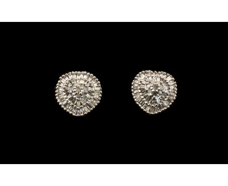 Diamond Cluster Earrings, .5ct; each having a raised centre of round cut diamonds framed by two, stepped rows of baguette cut