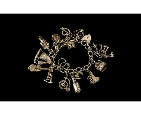 Vintage Sterling Silver Bracelet Loaded with 15 Silver Charms. All Marked for Silver. Some Interesting Old Charms and All In 