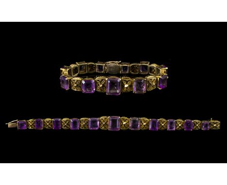 Victorian Period Superb Quality 9ct Gold - Amethyst Set Ornate / Fancy Bracelet, The Eleven Emerald Cut Amethysts of Good Col