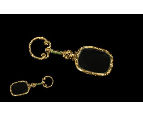 A Victorain Yellow Metal &amp; Enamel Gentleman's Eye Glass. With scroll loop finial and enamelled handle. With a scroll fram