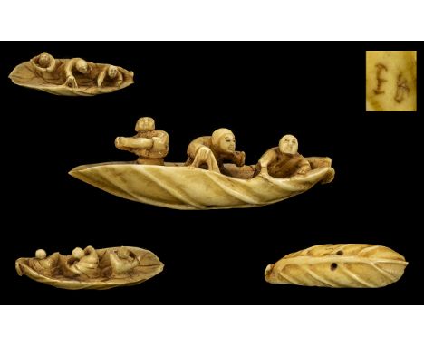 Japanese 19th Century Fine Quality and Signed Carved Ivory Bone Netsuke In The Form of 3 Male Figures on a Leaf Boat. Signed 