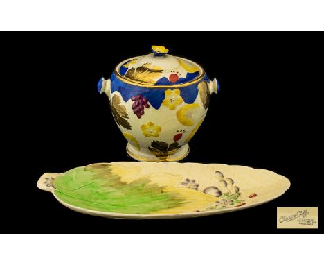 Clarice Cliff Leaf Shaped Pottery Dish yellow ground decorated with berries and flowers. Marked Clarice Cliff Newport Pottery