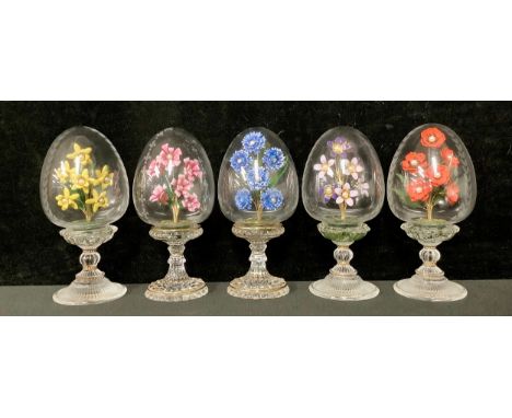 A set of five Franklin Mint House of Faberge clear glass pedestal eggs, each with an enamel floral spray accented with simula