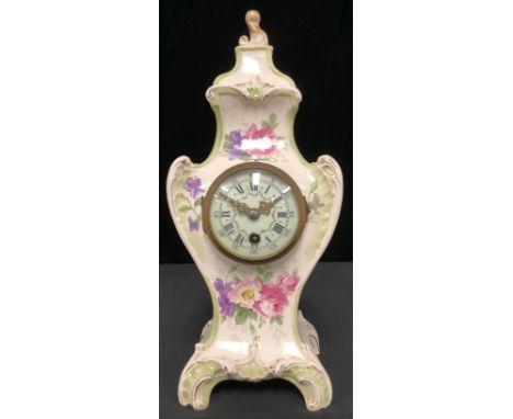 Clocks - A 19th century Royal Bonn floral porcelain cased mantle clock, the finial a gilded acanthus leaf, white enamel dial 