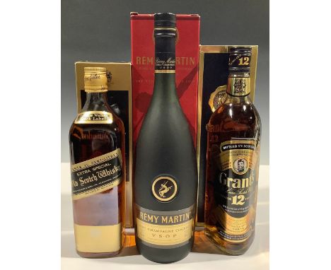 A bottle of Johnnie Walker Black Label Extra Special Old Scotch Whisky, 75cl, boxed; a bottle of Grant's 12 Year De Luxe Scot