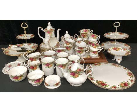 A Royal Albert Old Country Roses pattern teapot, coffee pot, bachelor’s teapot, two tiered cake stands, two cake stands, cups