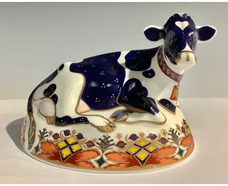 A Royal Crown Derby paperweight, Friesian Cow Buttercup, silver stopper, 16cm wide, printed mark in red, second quality 