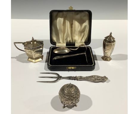 A George V silver hexagonal mustard and pepper, Birmingham 1919; a silver Christening set, Birmingham 1933, cased; an Indian 