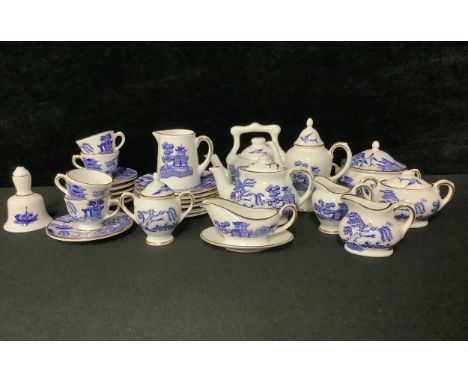 A Coalport miniature Willow pattern tea and dinner service, printed in blue and white, comprising teapot, tea kettle, coffee 