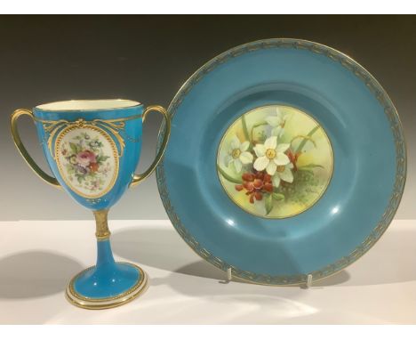 A Royal Worcester circular plate, painted by Albert Shuck, signed, with spring flowers on mossy ground within gilt lined bord