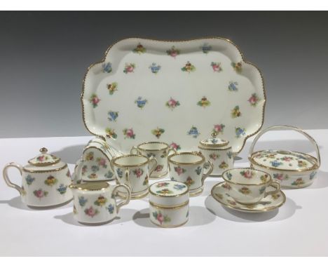 A Mintons miniature tea service, painted with scattered flowers, gilt edged rims, comprising teapot, sucrier and cover, cream