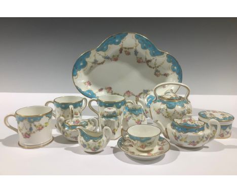 A Royal Crown Derby miniature tea service, decorated with floral and gilt swags beneath a pale blue wavy border, comprising t