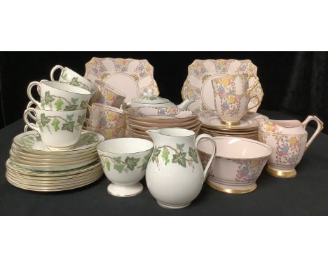 A Wedgwood Santa Clara part tea service comprising teapot, cake plate, side plates, cream jug, cups and saucers; a Plant Tusc