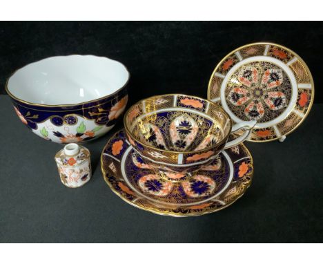 A  Royal Crown Derby Imari 1128 pattern teacup and saucer, year cypher for 1931; a Royal Crown Derby Imari 8453 pattern sugar