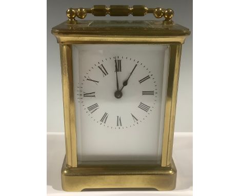 An early 20th century lacquered brass carriage timepiece, rectangular enamel dial inscribed with Roman numerals, 14cm high ov