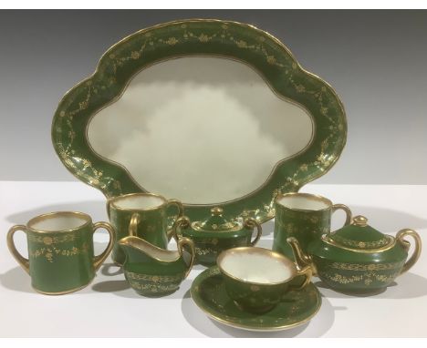 A Royal Doulton miniature tea service, comprising teapot, sucrier and cover, cream jug, teacup and saucer, on quatrefoil tray