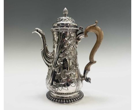 A George II coffee pot with wooden handle and hinged lid, profusely decorated with floral swags.London 1757. 32.33ozHeight 26