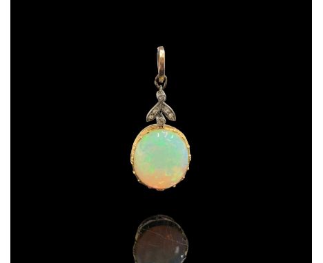 An Edwardian gold-mounted opal pendant, it hangs from a diamond set trefoil and a plain gold ring. Max height 30mm (the opal 