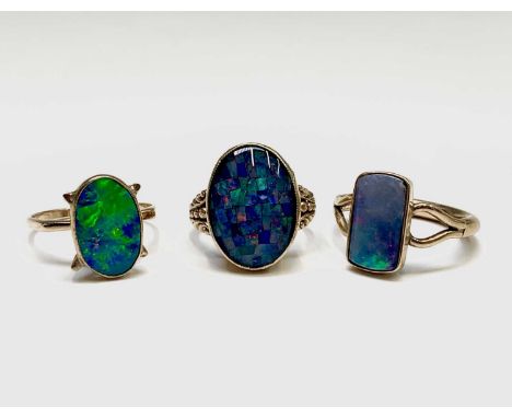 Three opal set gold rings 12.1gmCondition report: Approx sizes:rectangular stone: Ssmaller oval : Q-RLarger stone: L1/2 - MSe