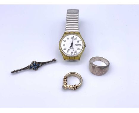 A high purity gold craft ring set a moonstone 11.6gm (tests as 18ct), a Swatch watch, a heavy silver ring and a silver bar br
