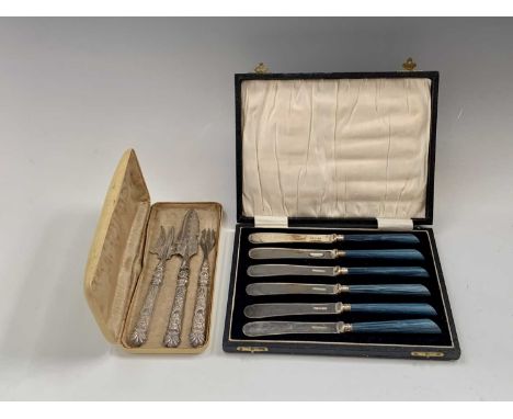An Edwardian silver butter knife of unusually ornate design by A J Bailey Birmingham 1902 together with a matching pickle for
