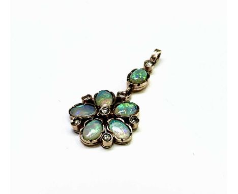 A fine Victorian-style pentamerous flowerhead gold pendant, each petal an oval opal separated by single diamonds and at the c