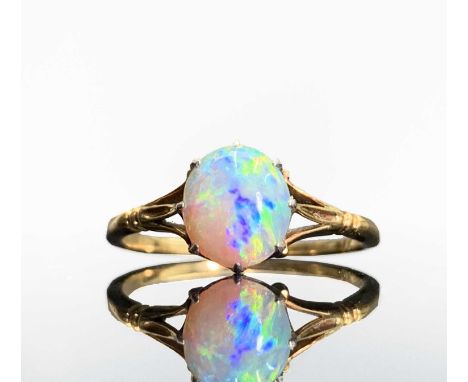 An 18ct gold opal set ring with elegant fleur-de-lis setting 1.8gmCondition report: Size LVery pretty setting, stone secure. 