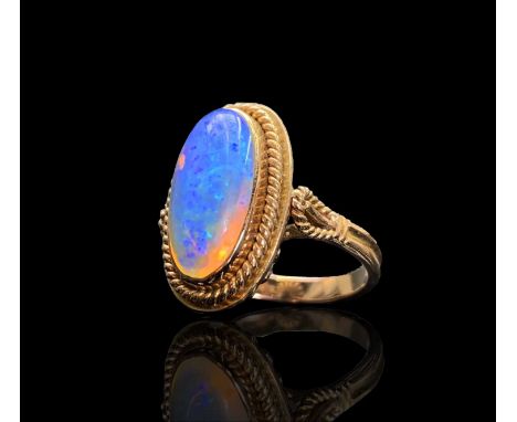 A 14ct gold ring set with an opal in rope-twist borders 6gmCondition report: The opal is fully enclosed (see photo) approx op