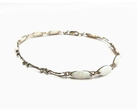 A gold and opal bracelet ( stones missing).