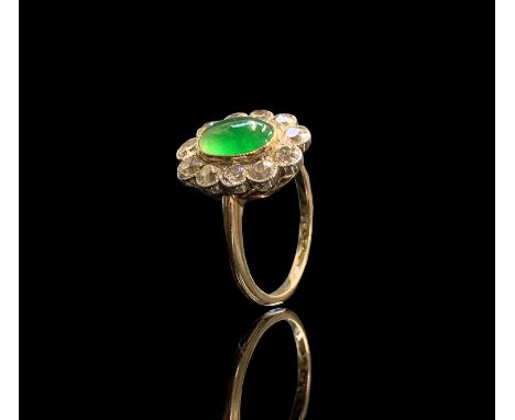 A cabochon emerald and diamond oval cluster ring 3.6gmCondition report: Approx size K-L, unhallmarked but tests as 18ct. Emer