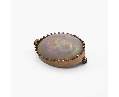 A gold-mounted opal pendant/brooch 35mm 13.9gm