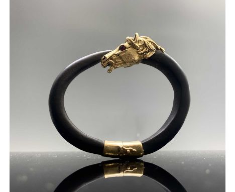 Gay Freres. An impressive 1970's wood and 18ct gold bangle of a stallion's head set with ruby eyes. Hallmarked 750 twice and 