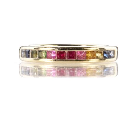 A rainbow sapphire half eternity ring in 18ct white gold set with twelve princess cut sapphires of various colours. Ring size