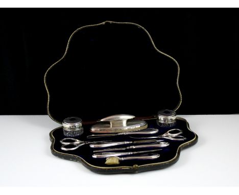 An antique George V Sterling Silver ladies manicure / vanity set by Henry Matthews, Birmingham 1911. Comprising ten pieces in