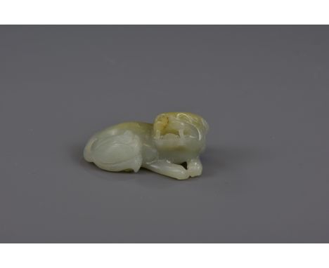 A Chinese 19th century carved white jade lion. 6cm
