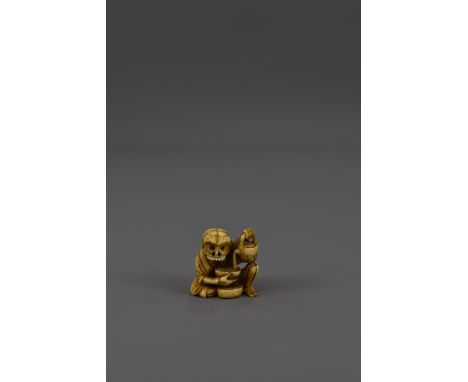 A Japanese 19th century Meiji period marine ivory netsuke figure of a skeleton pouring tea