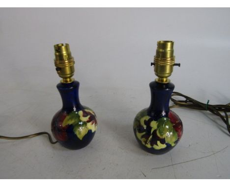 Moorcroft pair of Hibiscus cobalt blue 5 inch lamp bases, beautiful collectors pieces. 