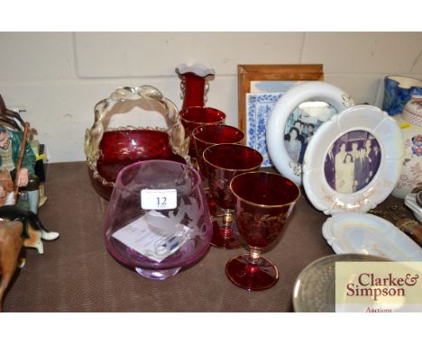 Four ruby glass goblets with gilt decoration; a red glass vase; an amethyst vase etc.
