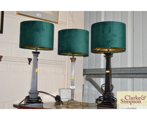 A modern brass table lamp; and a pair of Laura Ashley table lamps