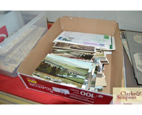 A box of various post-cards and First Day covers 
