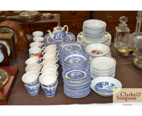 A collection of J &amp; G Meakin Studio poppy decorated dinnerware and a collection of blue and white "Willow" patterned dinn