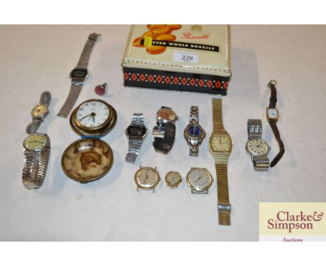 A tin containing travelling clock, and various wrist watches to include a Claude Valentini Premier Sport Watch; Timex and Sek