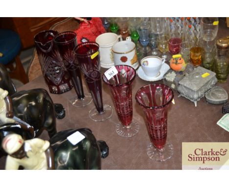 A collection of Ruby Flash glassware to include a jug and two pairs of vases