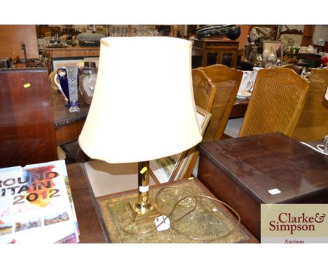 A brass column table lamp and shade