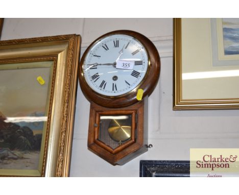 A small oak cased wall clock 