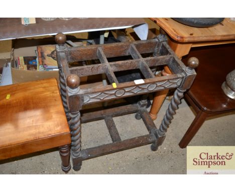 A carved oak and barleytwist stick stand 