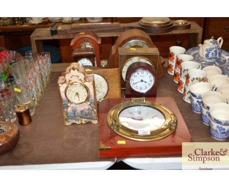 A ships style wall clock and various mantel clocks