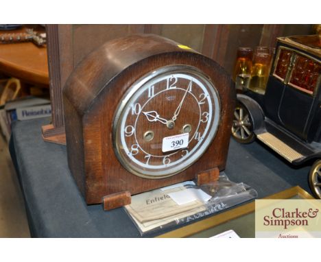 A Smith Enfield oak cased two hole mantel clock 
