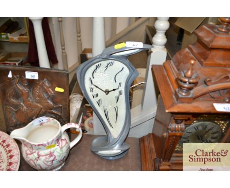 A decorative mantel clock in the style of Salvador Dali 