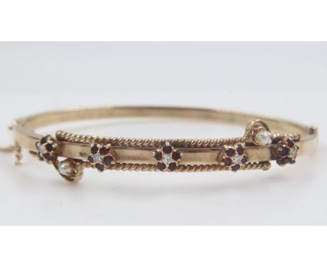 Gold bangle decorated with rubies, diamonds and seed pearls, 12.6g. UK P&amp;P Group 1 (£16+VAT for the first lot and £2+VAT 